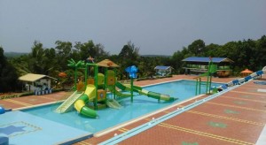 By Rail network: It is situated 4 Kilometres from Kundapura Railway station on Konkan Railway which runs from Mumbai to Mangalore. The railway station is about 4 kilometres (2.5 mi) from the town. By Road: The resort is just 8 Kms from the main highway NH17. NH17 connects (renumbered as NH66). This Highway connects cities and towns of different states as follows: Panvel, Mahad, Khed, Chiplun, Hatkhamba (Ratnagiri), Rajapur, Kankavali, Kudal, Sawantwadi, Panaji, Margao, Karwar, Kumta, Bhatkal, Kundapur, Udupi, Surathkal, Mangalore, Kasaragod, Taliparamba, Kannur, Thalassery, Vadakara, Kozhikkode, Kottakkal, Ponnani, Kodungallur, North Paravur and Edappally in Kochi. H52 is the main State Highway that connects to Shimoga District. It has 84 km length and passes through Koni, Basrur, Kandlur, Siddapura, Hosangadi, Balebare, Nagara and Thirthahalli. Kundapur also has better connectivity to Malenadu (Chikamagalore District) via Karkala. By Air: The nearest airport is Manglore International Airport , situated at Bajpe around 87 kilometres (54 mi) from Kundapur.